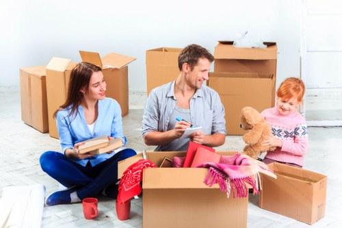 Removalist truck and packed moving boxes in Footscray street