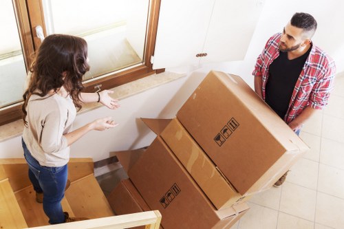 Staff member checking details while handling a storage complaint
